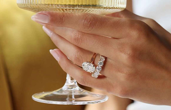 Engagement finger guide with tips on ring placement, stacking, and wedding ring